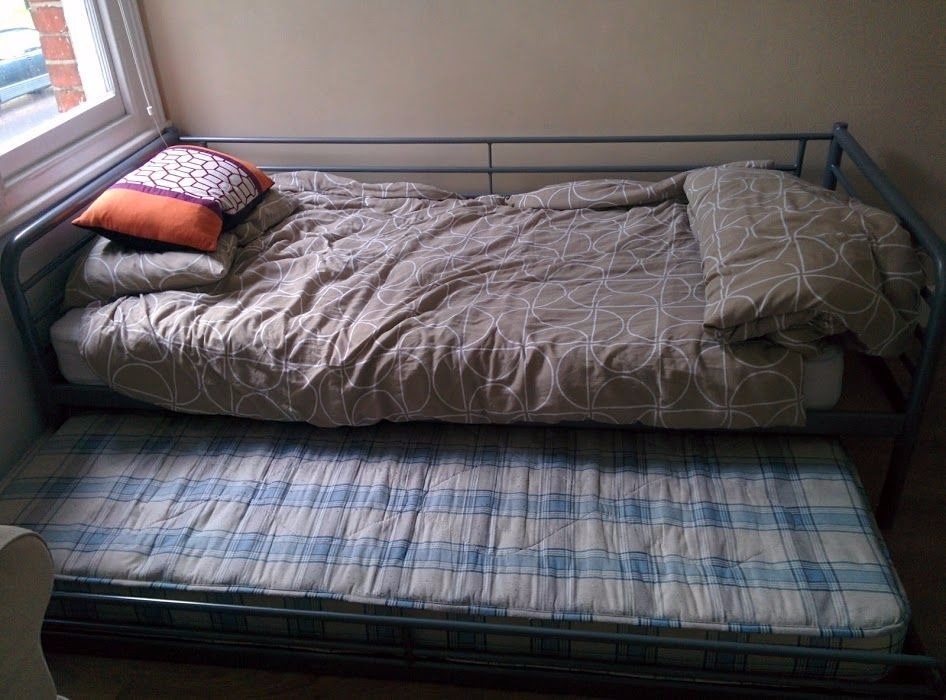 Metal single bed with trundle pull out and mattresses in Hillingdon