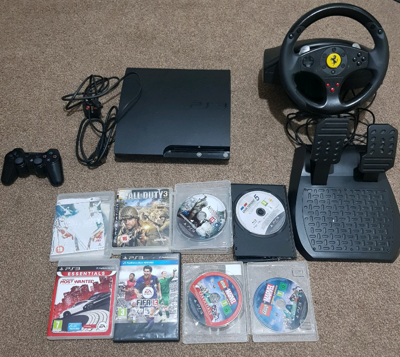 PS3 BUNDLE WITH STEERING WHEEL & GAMES in Moseley, West Midlands