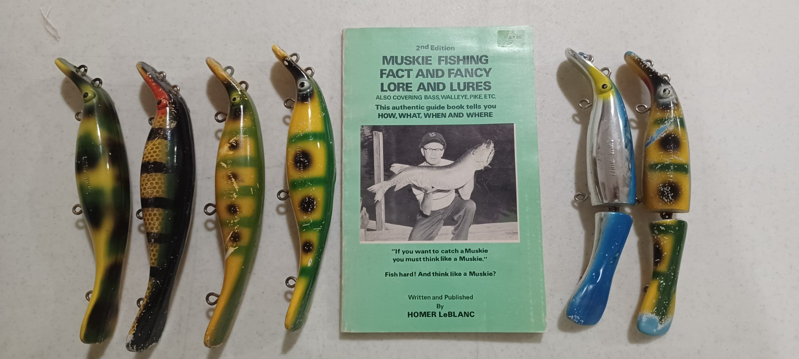 A vintage autographed copy by Homer LeBlanc and 6 of his