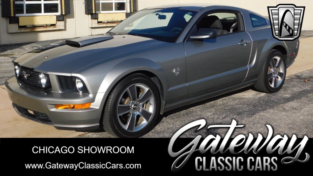 Gray with black racing stripes 2009 Ford Mustang  4.6L  V8 Manual Available Now!