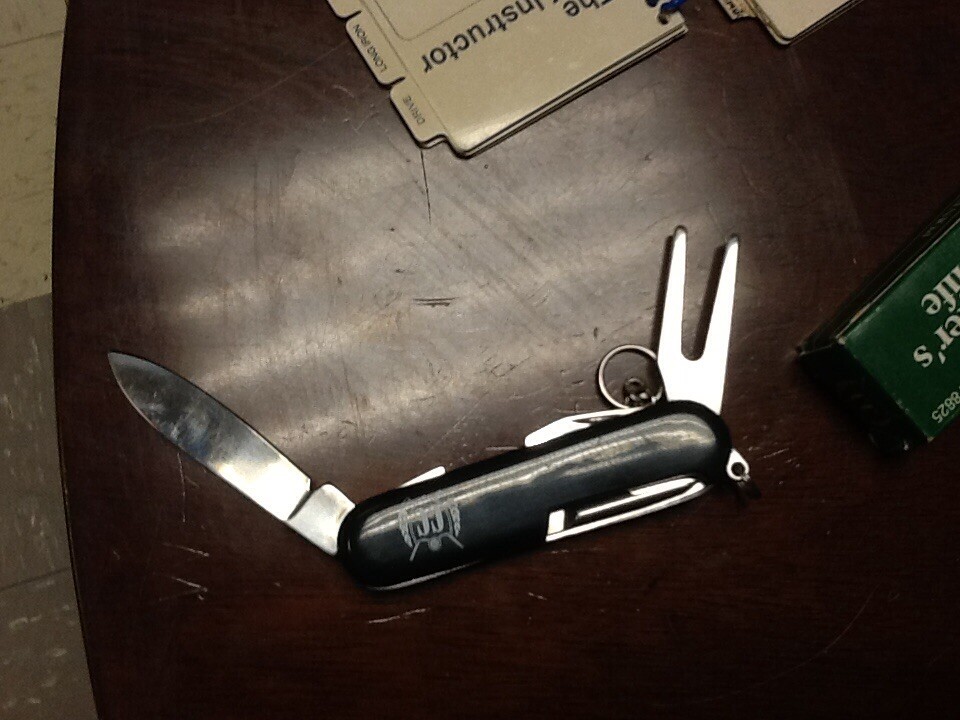 Pair of vintage Golf instructor pocket books and a golfers knife new in box