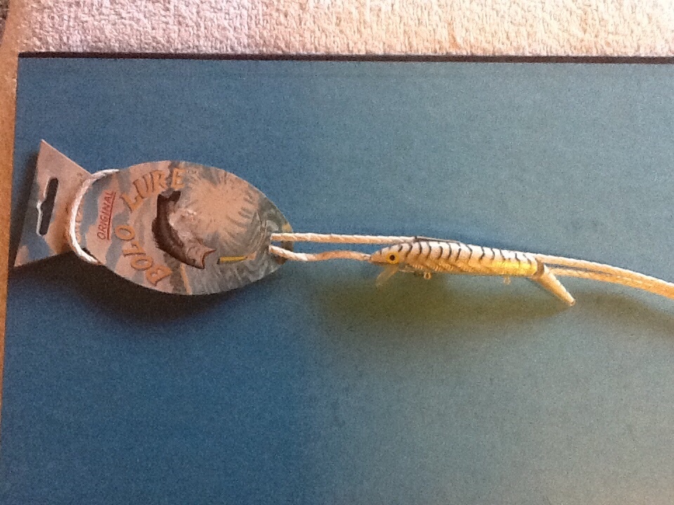 Vintage Bolo Tie featuring A Fishing Lure Embedded In Plastic Cord by Ed Evans