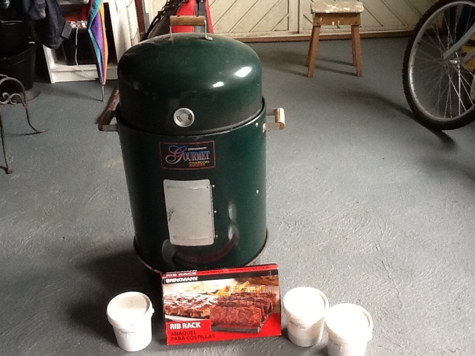 Brinkmann Gourmet Charcoal Smoker with BBQ ribs rack and selection of