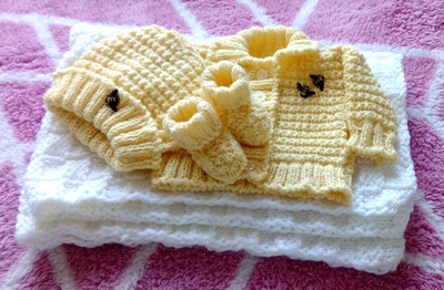 Hand knitted baby layette