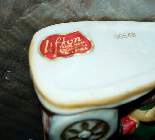 Colonial Village Figure Miniature by Lefton Boy Riding Bike With Packages