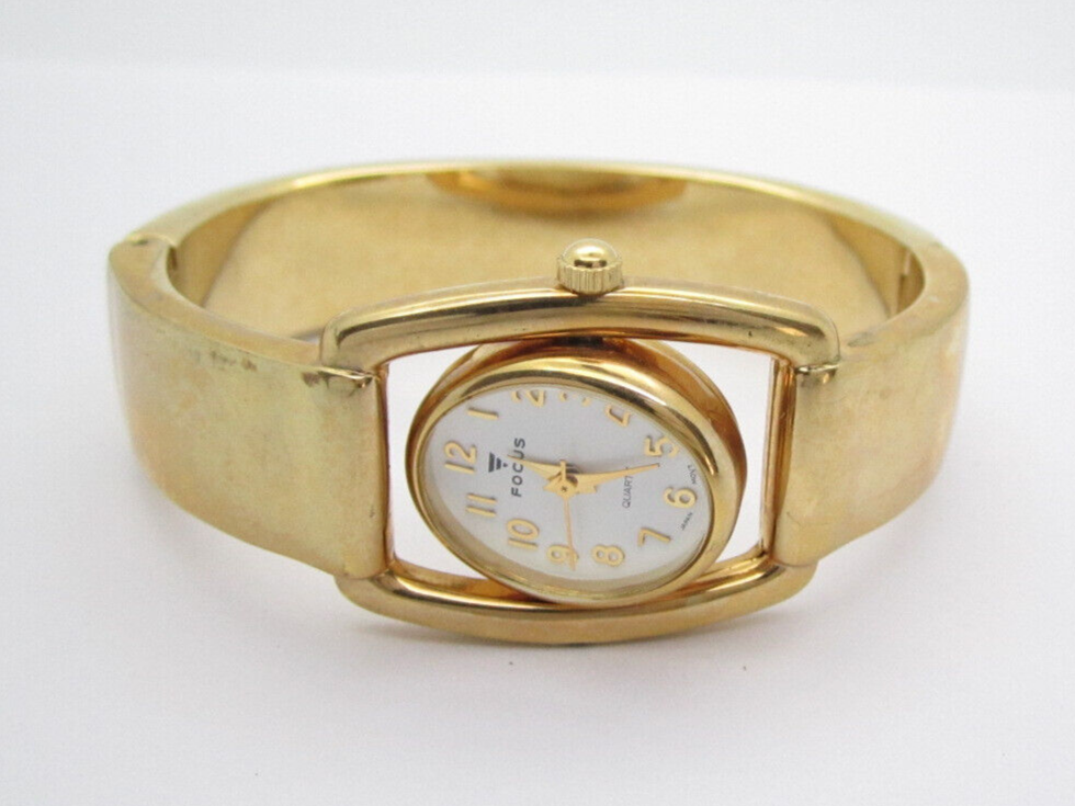 Women's Focus Quartz Rotating Analog Dial Causal Oval Bangle Watch (E3)