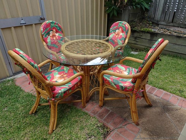 Cane dining table with glass top and 4 chairs with cushions | Dining