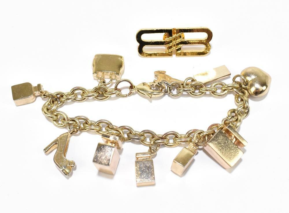 Dolce & Gabbana gold tone charm bracelet with Ten charms in