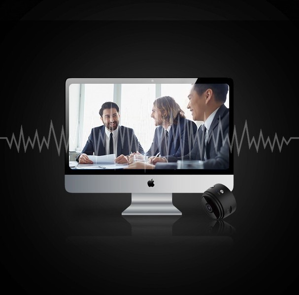 Business meeting displayed on iMac with external speaker.