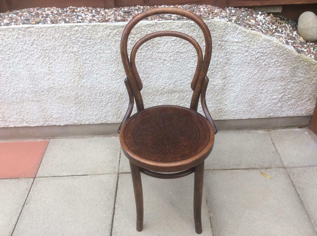 Old round wood kitchen chair with hand carved seat Mundus and J&J Kohn