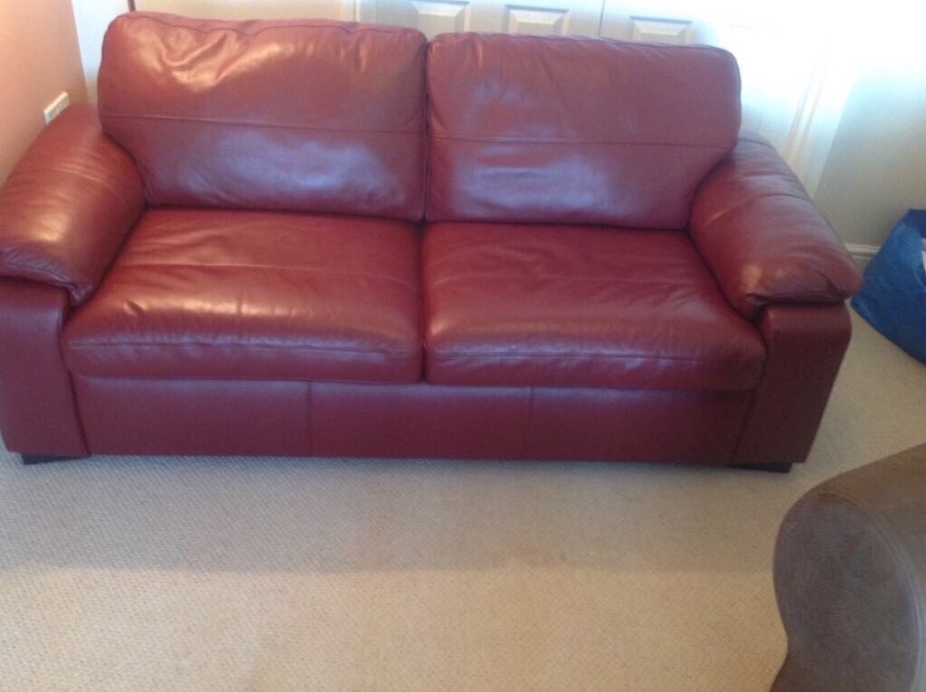 Excellent condition red leather sofa bed 3 seater, 1 seater and foot
