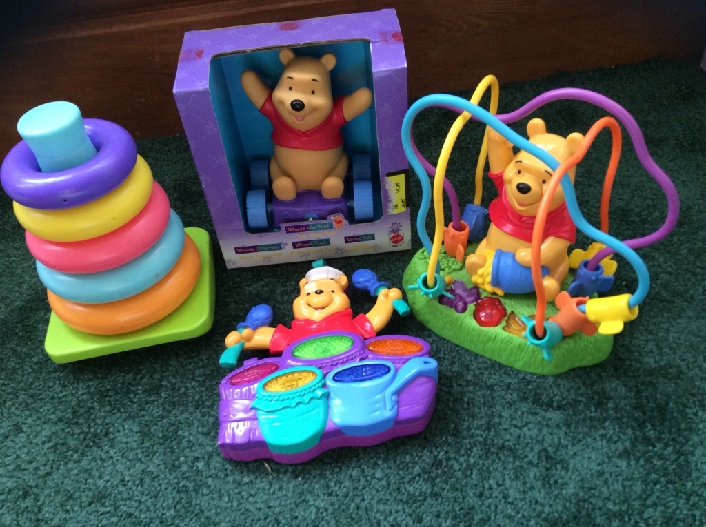 Winnie the Pooh baby toys x3 and stacking hoops in Exeter, Devon