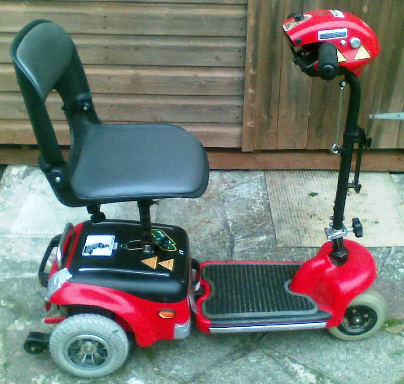 Mobility Scooter & Charger. InvaMed Wispa model. Folds down to put into the car boot etc. in