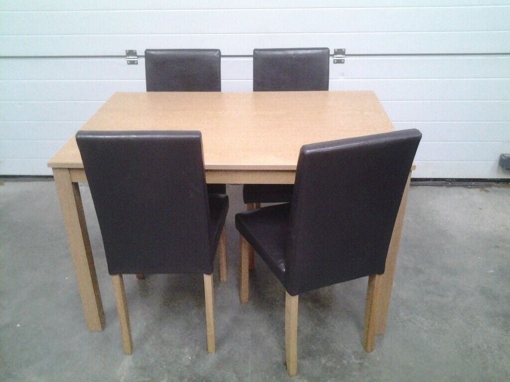 Ex display Dining table and 4 dark choc faux chairs 