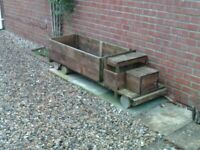 Large garden planter. Truck design. Treated wood. Good capacity. Good condition.