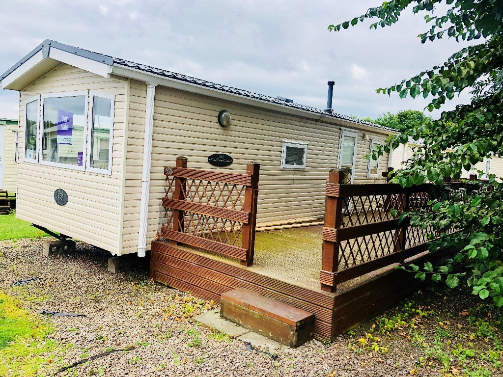 Cheap preloved caravan, with decking for sale in the Scottish Borders