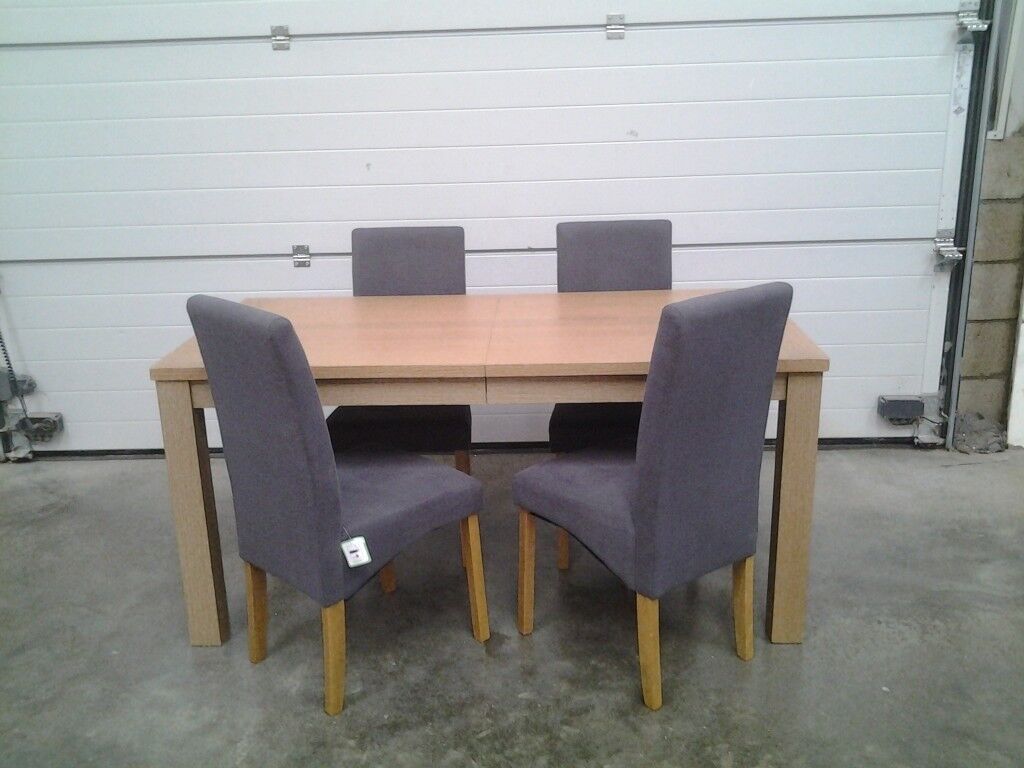 Ex display Extendable dining table and 4 grey fabric 