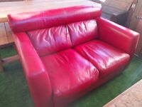 Used red leather two seater M&S sofa