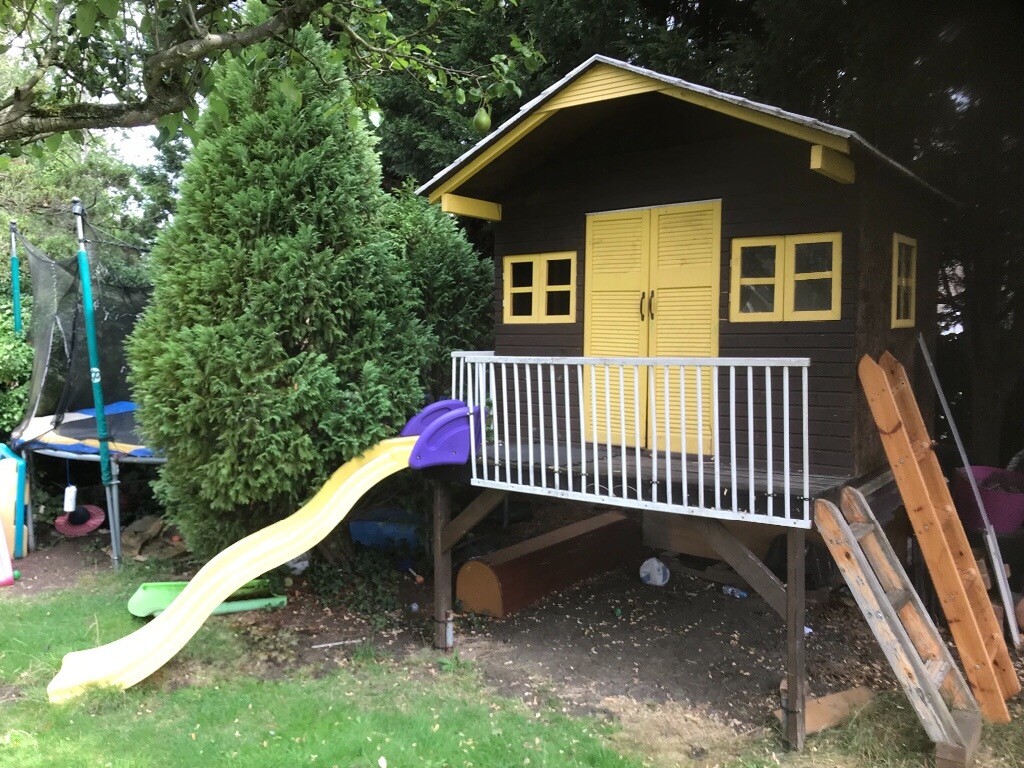 Large handmade tree house treehouse playhouse on platform with slide