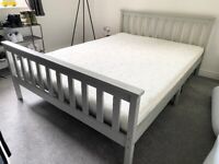 Grey double bed with mattress - less than a year old