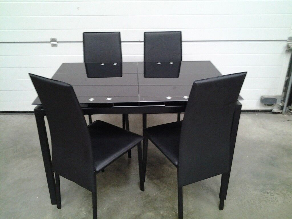 Ex display Black glass extendable dining table and 4 free 