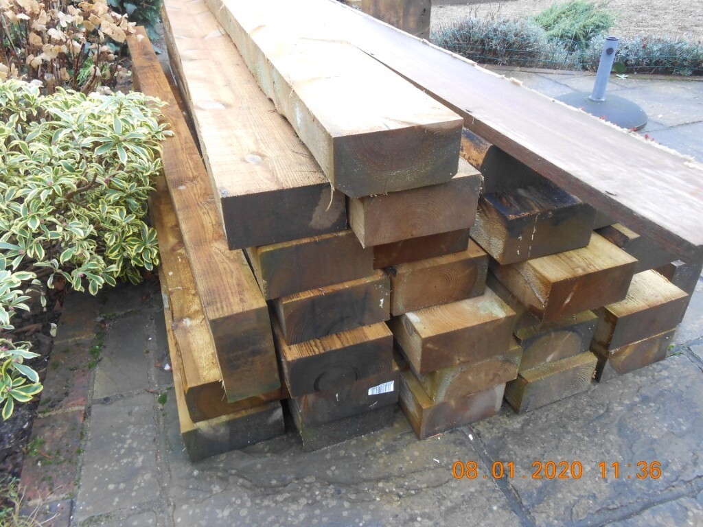 Green treated wooden sleepers for sale in West Chiltington, West