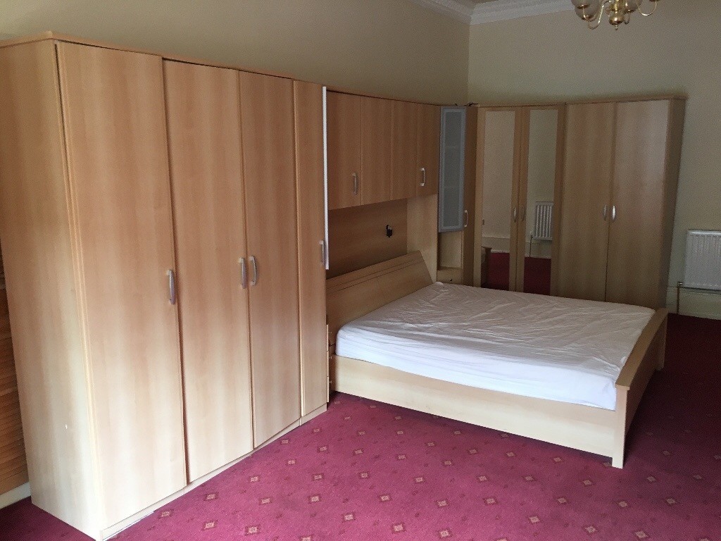 Double bed, with wardrobes and overhead storage. Very good condition
