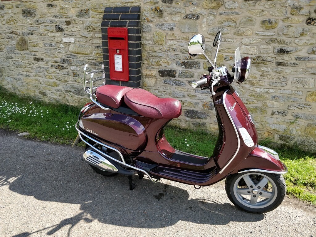  VESPA  LXV 125ie in maroon  in Cheltenham Gloucestershire 