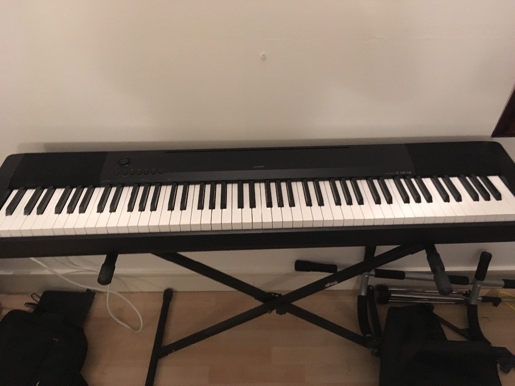 Casio CPD 120 weighted 88 key electric keyboard with stand. in