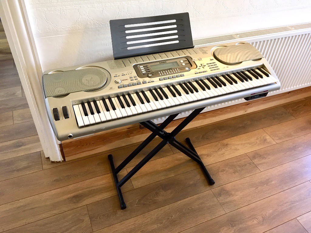 Professional Casio WK 3700 Keyboard, 76 keys, good condition, with stand,  manual and music books.