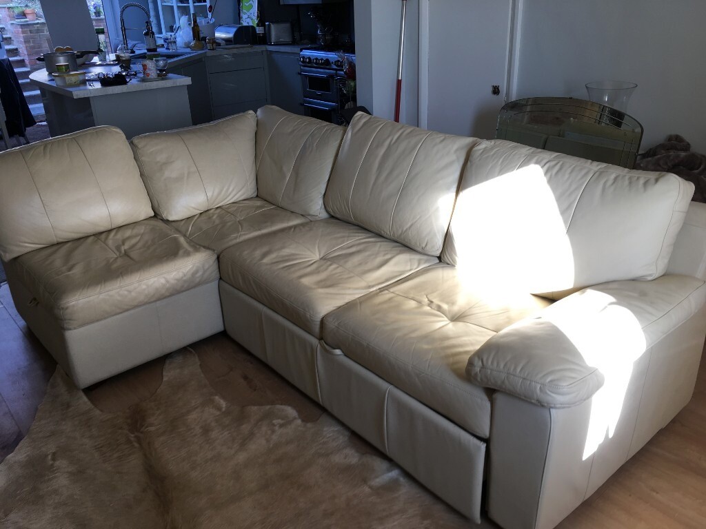 Compact, cream leather corner sofa and sofa bed in Brighton, East