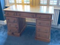 Solid pine pedestal desk with 9 drawers. 