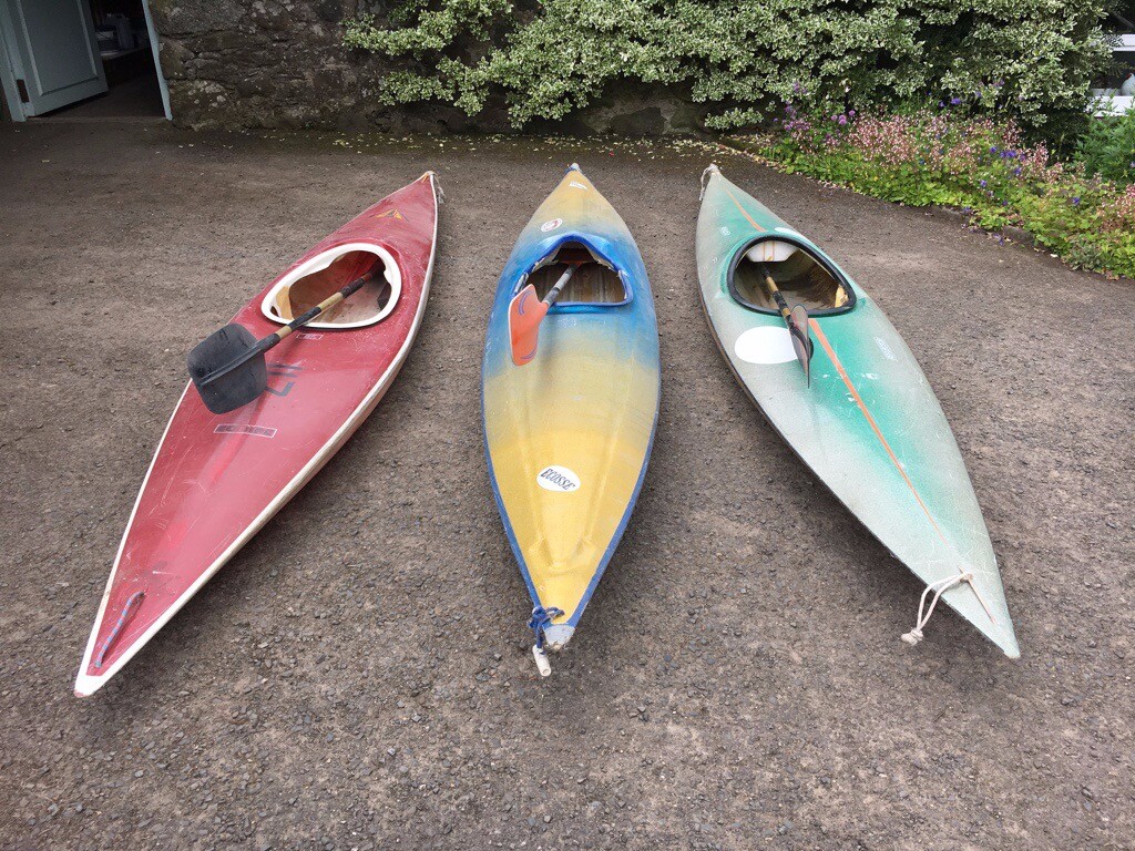 Fibreglass slalom kayaks with paddles in Crieff, Perth and Kinross