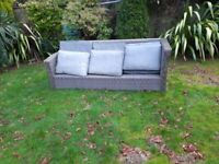Garden bench with cushions