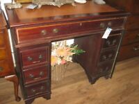 SMALL KNEE HOLE, LEATHER TOPPED DESK. SPLITS IN 3