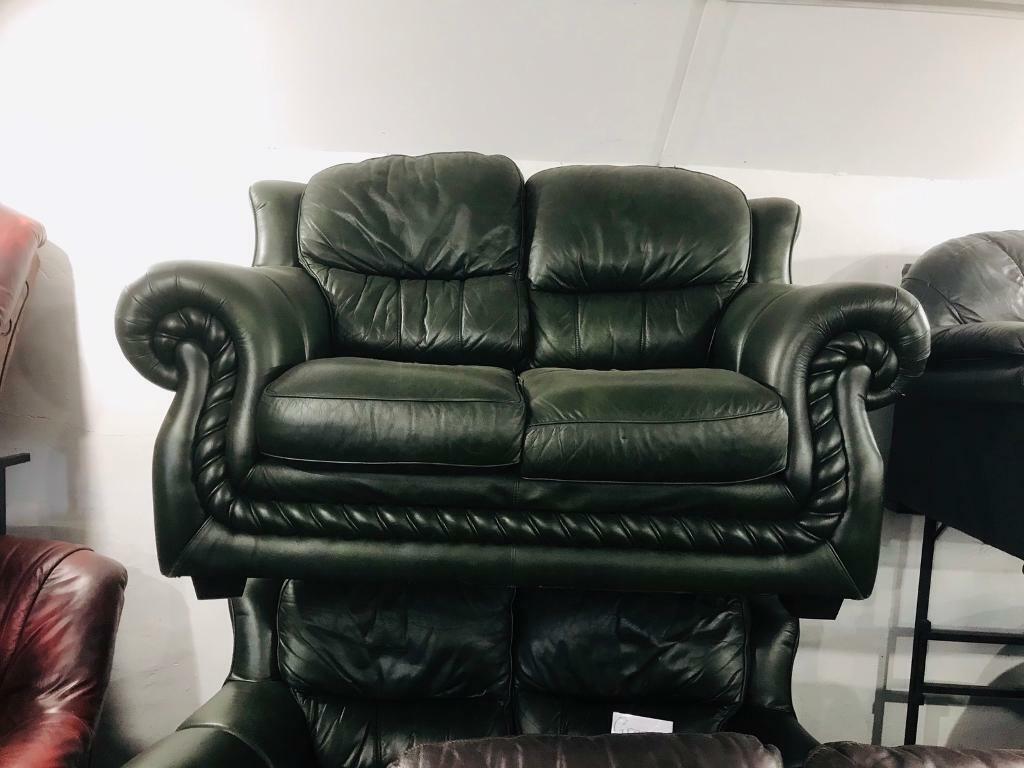 2 quality dark green leather 2 seater sofas in Dunmurry, Belfast