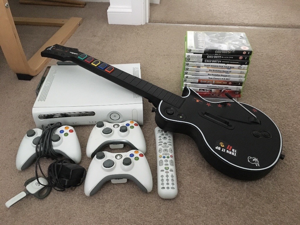 Xbox 360 + 1 controller + Guitar Hero pack + DVD remote + wireless