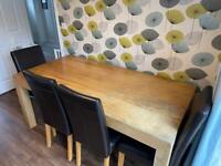 Large solid wood rectangular table with bench and 4 chairs