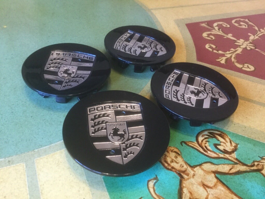 PORSCHE BLACK & SILVER WHEEL CENTRE CAPS SET OF 4 BRAND NEW in