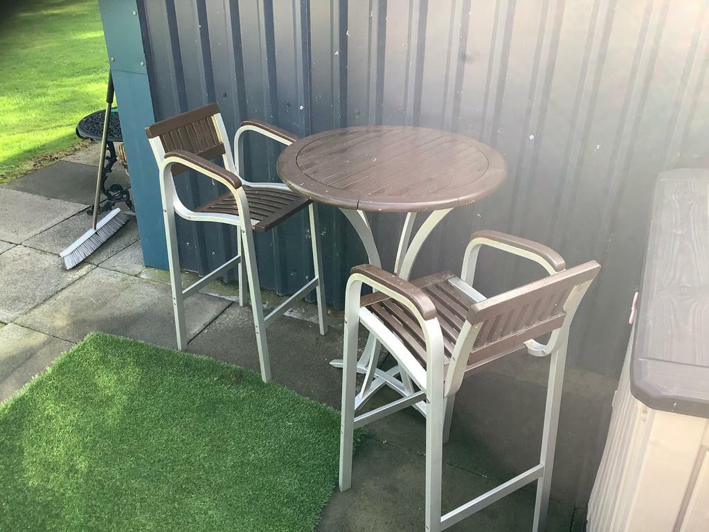 OUTDOOR etc bar table and 2 high bar chairs. Great for man/woman cave