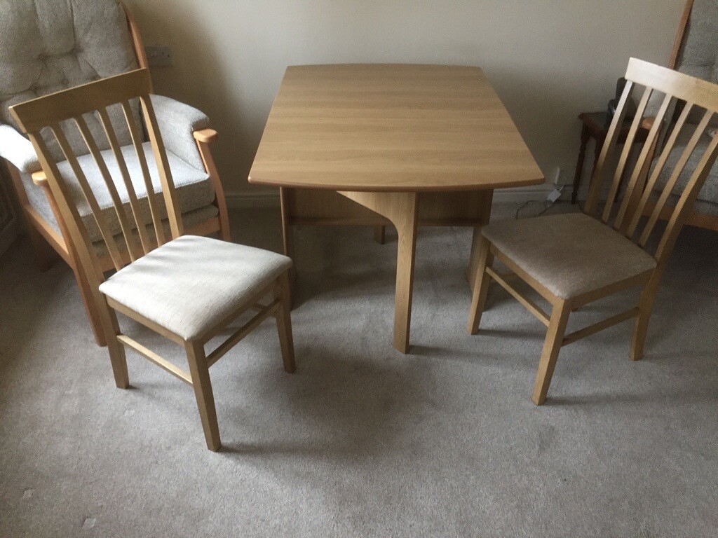 Tuftop dining table and 2 chairs purchased from Glasswells in Ipswich