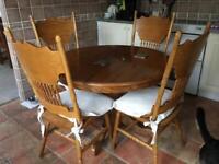 Excellent round wooden table and 4 chairs