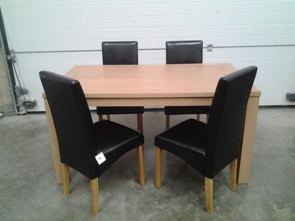 Ex display Excellent Dining table and 4 black faux chairs 