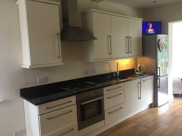 Cream Kitchen With Granite Work Top And Undercounter Stainless