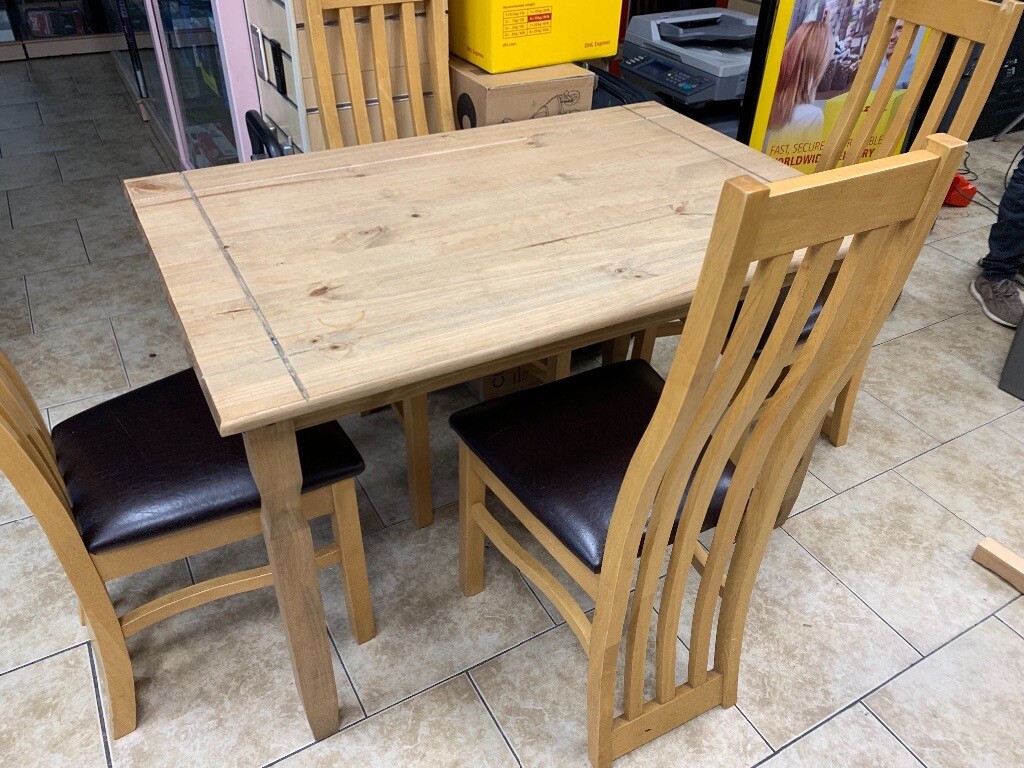 Solid wood dining table with 4 chairs in Leicester, Leicestershire