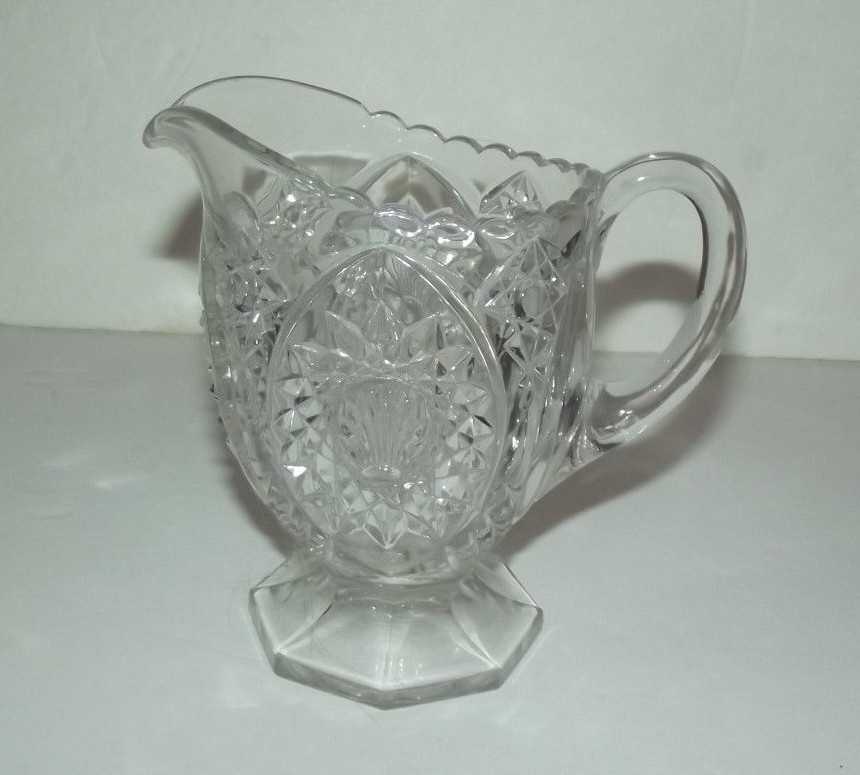 NEAT UNMARKED DECORATICE GLASS PITCHER WITH SEASHELL DESIGN
