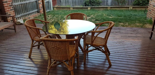 Casual cane dining table. 4 seater with smoked glass top ...