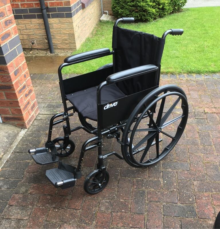 Wheel chair, folding, black. Condition is used suitable for an Adult