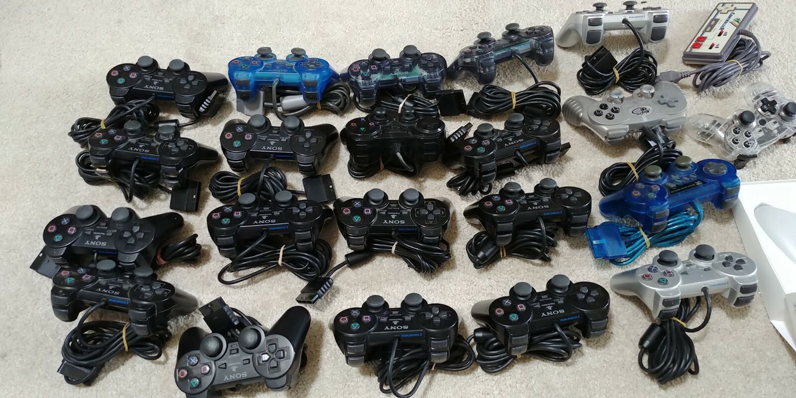 Wholesale lot; 23 Broken Controllers, mostly PS2. For PARTS/REPAIR, AS-IS.