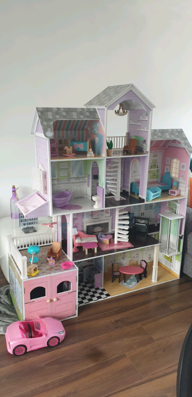 Doll house with free barbie car | in Aberdeen | Gumtree